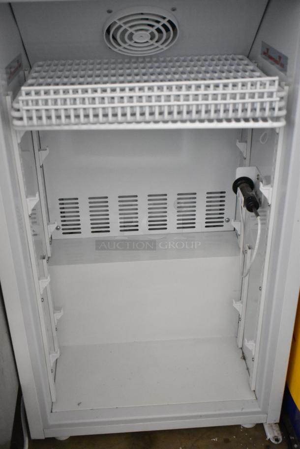 2019 Accucold ARG3PV mini cooler merchandiser with poly-coated racks, 115 volts, shown in open condition.