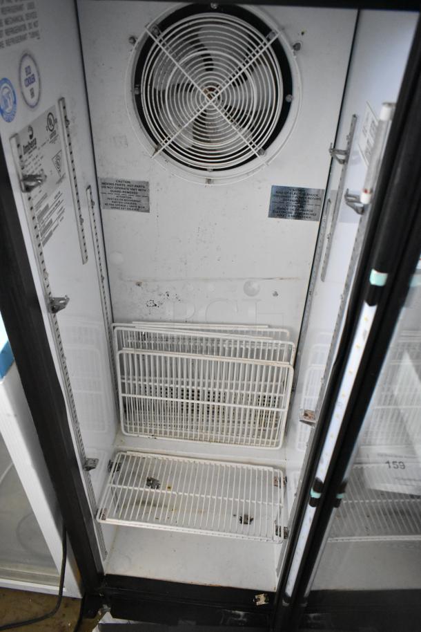 Imbera VRS05 metal single door reach-in cooler, poly coated racks, visible wear, 115 volts, internal fan and caution labels.