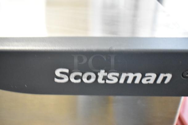 Scotsman stainless steel commercial ice head, model C1030MA-32B. Features 208/230V, 1 phase. Logo visible on edge.