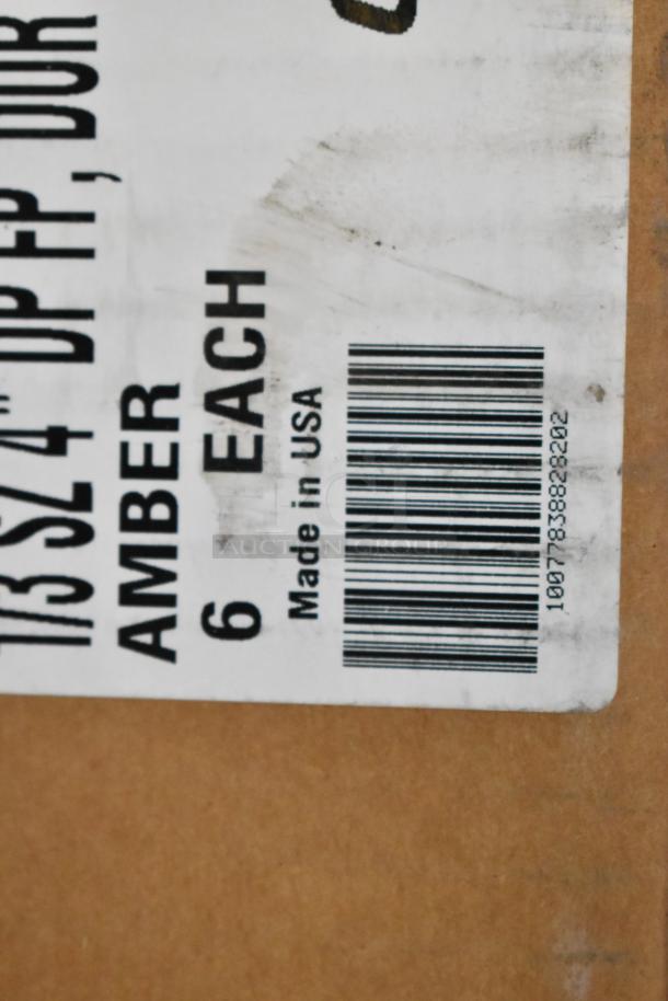 Label on box indicating Carlisle 1/3 size amber food pans, 6 each, made in USA. Barcode visible.