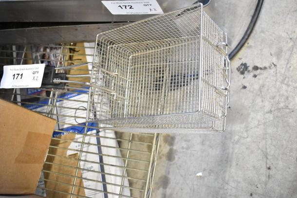 Two metal fry baskets with wire mesh design, sturdy handles, clean condition. Quantity tag indicates set of two.