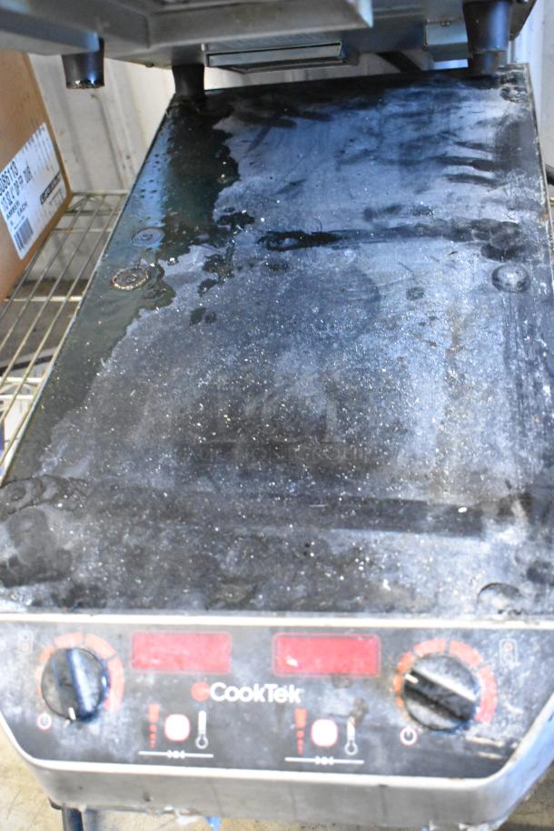 CookTek MC2502F 2-burner induction range, worn condition with visible dirt and damage. One unit with broken glasstop. 200-240V.