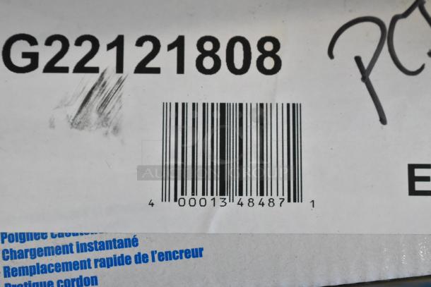 Barcoded label on Garvey G2212-08008 labeler box showing model G22121808. Slight scratch visible on surface.