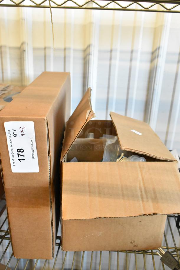 Two boxes containing brand new ACP PA10 oven paddle and Novo 147NFBSOAP foaming hand soap, labeled with item info.