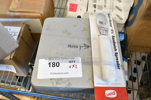 Mako 6600-M-W1-LTE router and Sani-Sharp sandwich spreader on shelf, auction tag displaying "180, qty x2."