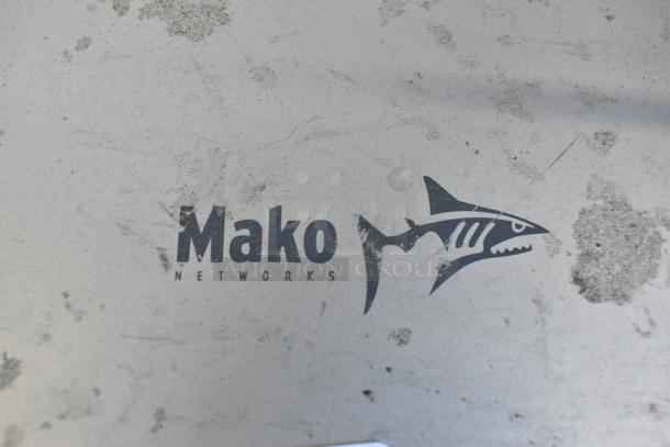 Mako 6600-M-W1-LTE Router showing the brand logo. Shows signs of wear; essential for network connectivity.