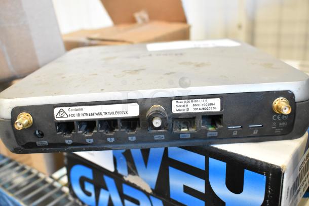Mako 6600-M-W1-LTE router, ports and labels visible, ID 301A28020836, Serial 6600-1901584, used condition.
