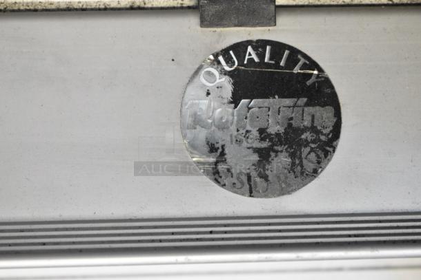 Tile cutter with a worn "Rotafix" label indicating quality. Marks suggest use. Condition shows signs of wear.