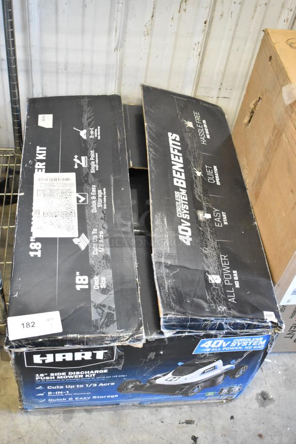 Hart 18" Side Discharge Push Mower Kit in original box, features 40V cordless system, cuts up to 1/3 acre, new condition.