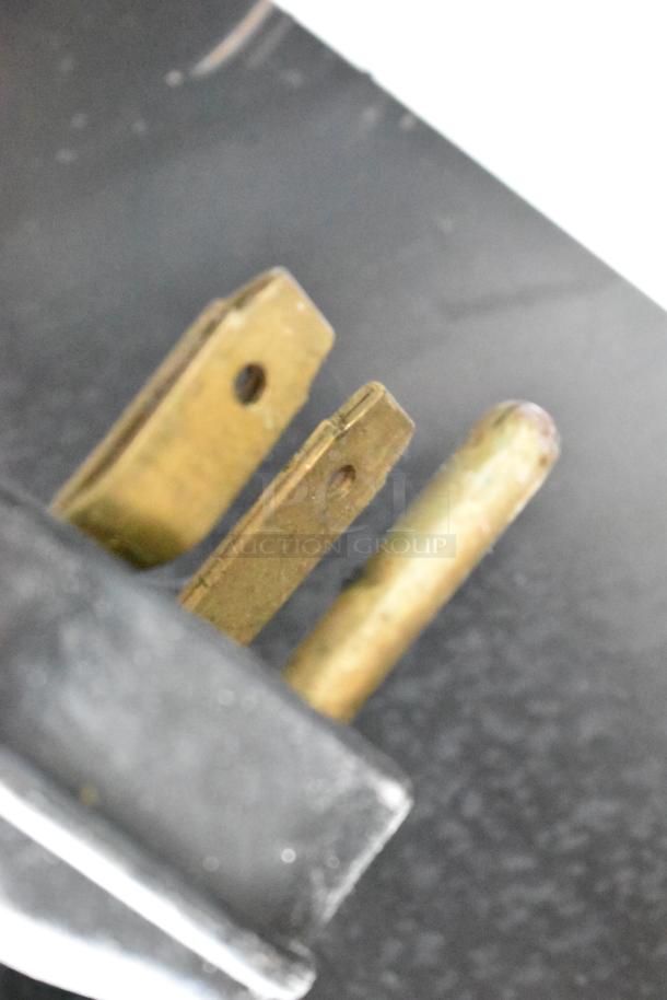 Close-up of a plug for the 2018 Amana MRC30S2 stainless steel commercial countertop microwave oven.