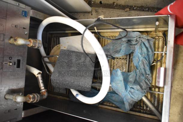 Pitco Frialator stainless steel fryer oil filtration system on casters, 115V, 1 phase, showing interior components and hoses.