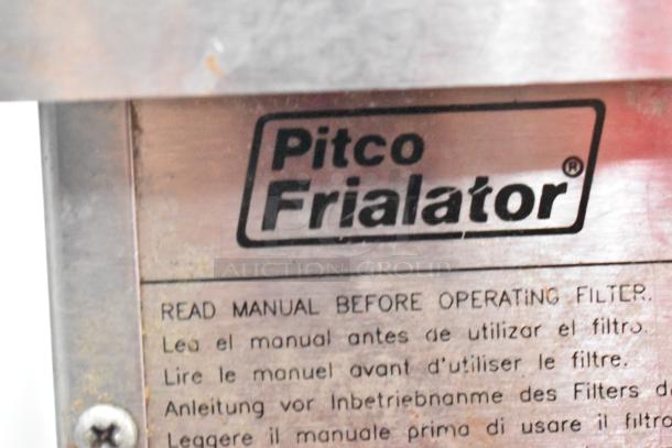 Pitco Frialator stainless steel commercial fryer oil filtration system, tag shows brand, manual instruction in multiple languages.