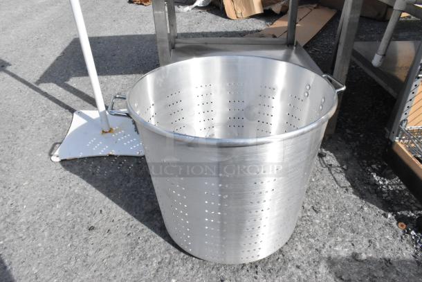 Aluminum 150 qt. tapered vegetable colander by Town, with perforated sides and sturdy handles, in good condition.