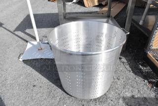 Aluminum 150 qt. tapered vegetable colander by Town, with perforated sides and sturdy handles, in good condition.