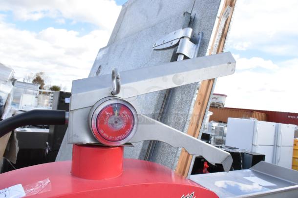 Metal red shelving unit with decorative fire extinguisher top, features red gauge labeled "Recharge" and "Overcharged."