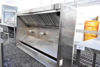 8' stainless steel commercial grease hood with filters and lights, visible wear, ideal for restaurant kitchens.