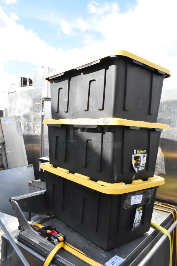 Three Member's Mark 27-gallon black polypropylene totes with yellow lids, new condition, stacked outdoors.