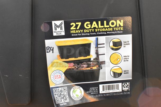 Member's Mark 27-gallon black poly tote with yellow lid. Features stackable design, lock holes, and built-in handles. Made in USA.