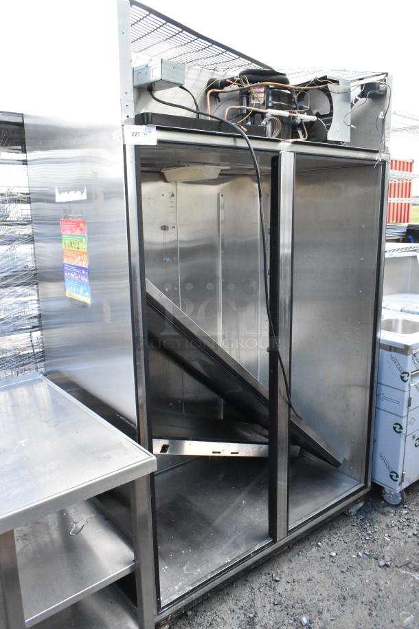 True TR2R-2S stainless steel commercial 2-door cooler, one door missing, 115V, 1 phase, visible wiring exposed.