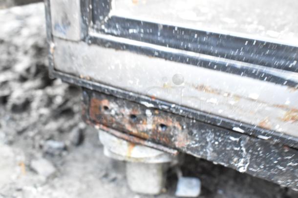 True TR2R-2S stainless steel commercial cooler with missing door, 115V, 1 phase, base detail shown, signs of wear.