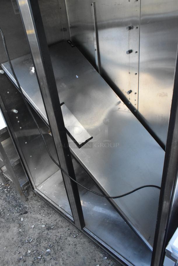 True TR2R-2S Stainless Steel Reach In Cooler, missing door, 115V, 1 phase, commercial model interior view.