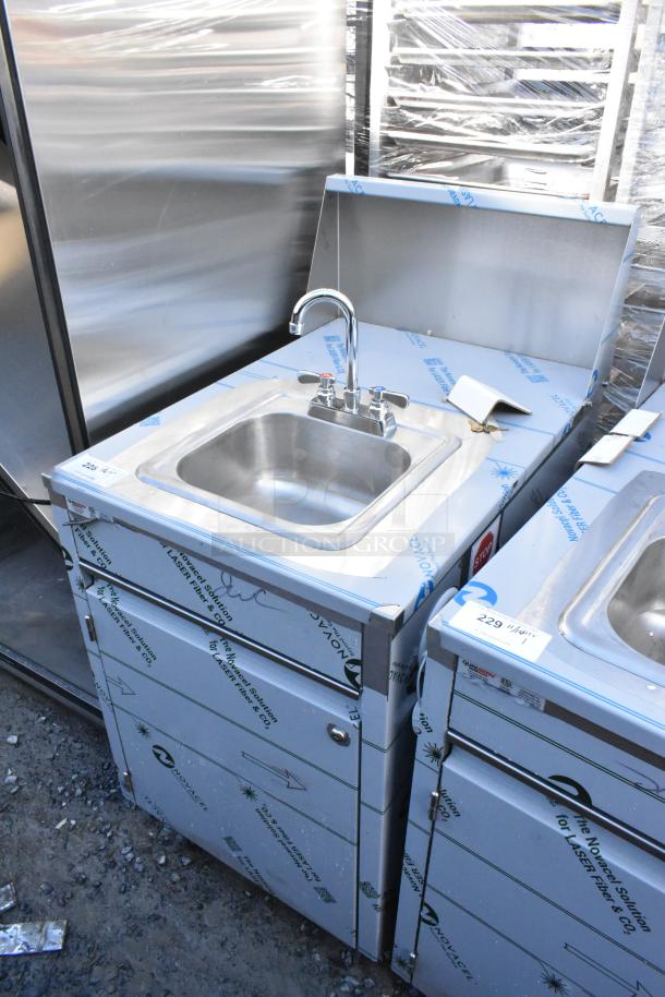 Brand new QualServ stainless steel commercial portable sink on casters. Features protective wrap, minor scratches.