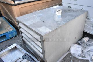 Metal commercial compressor for walk-in box, features louvered vents and sturdy construction. Moderate wear, no visible markings.