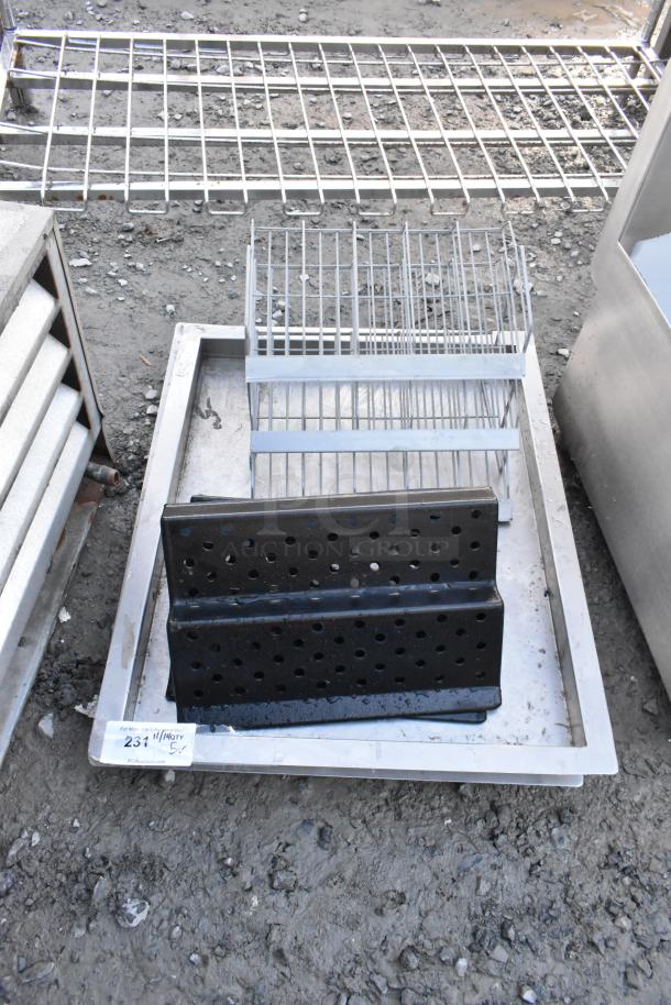 Lot of 5 metal pieces, including perforated black plates and silver wire racks. Auction tag indicates item number. Used condition.