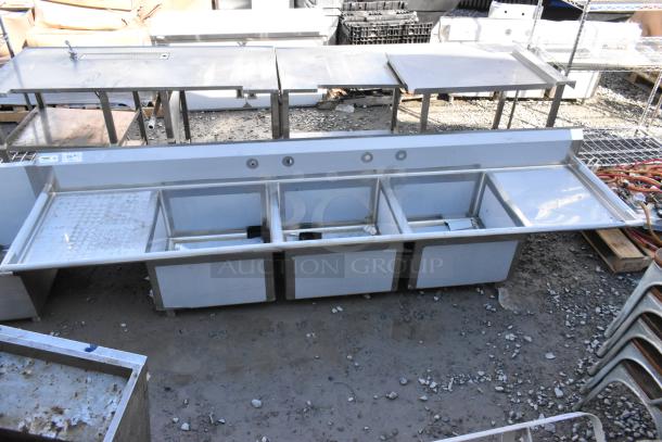 Brand new Regency 600S32424224 stainless steel 3-bay sink with dual drain boards. Scratch and dent, no legs included.