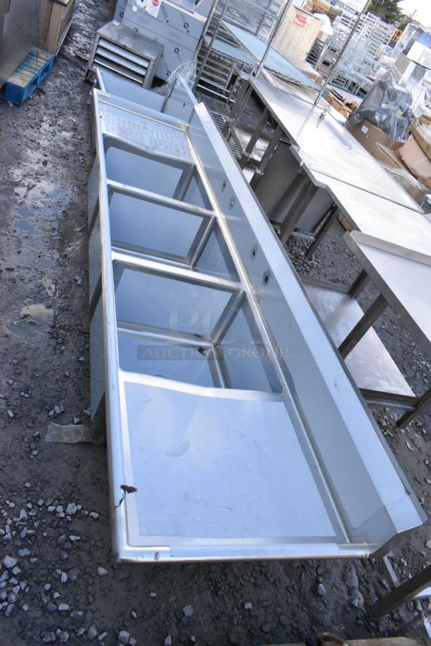 Brand new Regency 600S32424224 stainless steel 3-bay sink with dual drain boards, scratch and dent, no legs.