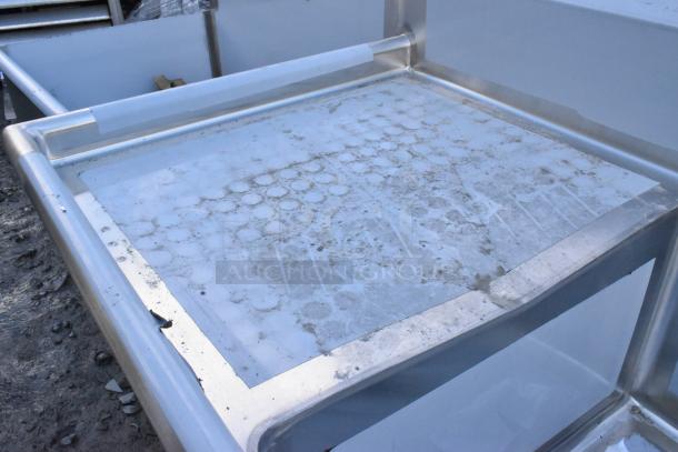 BRAND NEW Regency 600S32424224 stainless steel sink, 3 bays, dual drain boards, no legs, visible scratches and dents.