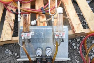 10 industrial panels with gauges and couplers. Includes hoses, mounted on wooden pallet. Panels show slight wear.