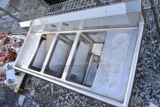 BRAND NEW SCRATCH AND DENT! Regency 600S31220212 16-Gauge Stainless Steel Three Compartment Commercial Sink with Galvanized Steel Legs and 2 Drainboards - 12