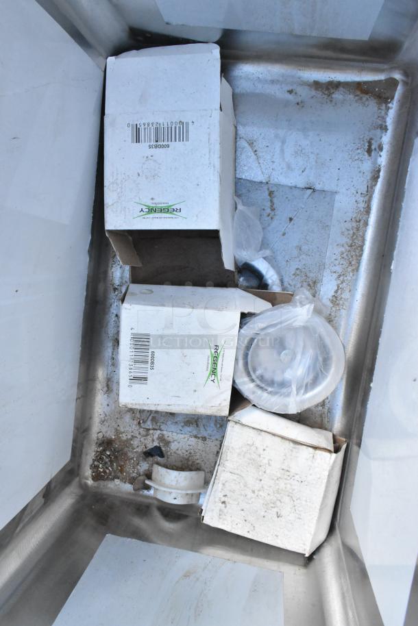 Brand new Regency 600S31220212 commercial sink, 16-gauge stainless steel, 3 compartments, 2 drainboards, minor scratches.