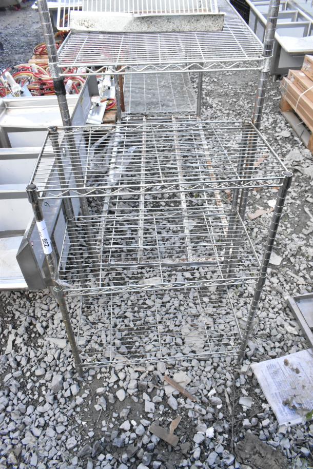 Chrome finish 3-tier wire shelving unit, sturdy and spacious, with visible marking "236". Buyer must dismantle for shipping.