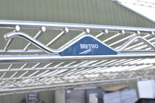 Metro Chrome 5-Tier Wire Shelving Unit, visible Metro logo, durable chrome finish. Buyer must dismantle. Consider freight.