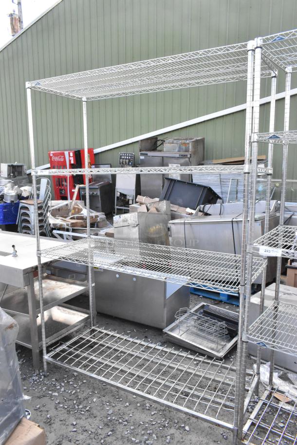 Metro Chrome Finish 4-tier wire shelving unit. Sturdy metal design, visible wear. Buyer must dismantle, consider freight.