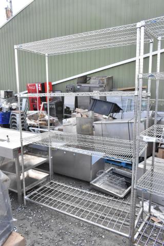 Metro Chrome Finish 4-tier wire shelving unit. Sturdy metal design, visible wear. Buyer must dismantle, consider freight.