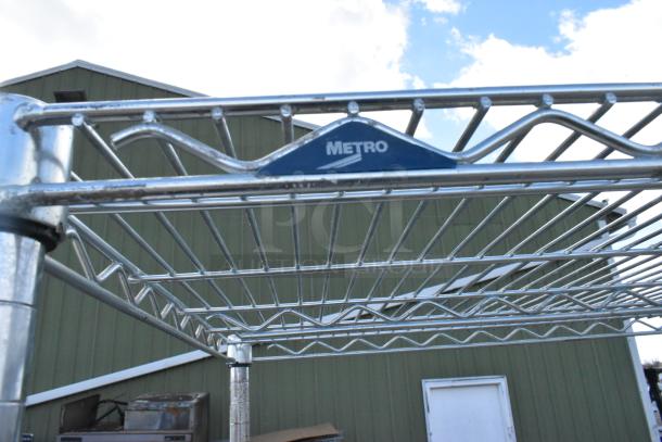 Metro chrome finish 4-tier wire shelving unit, durable metal with visible brand label. Buyer must dismantle.