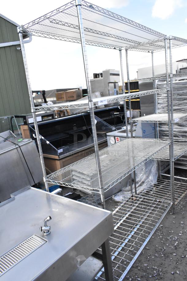 Metro chrome finish 4-tier wire shelving unit. Sturdy metal construction, used condition. Buyer must dismantle.