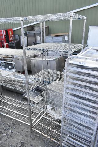 Metro chrome finish 5-tier wire shelving unit; used condition, buyer must dismantle and consider freight charges.