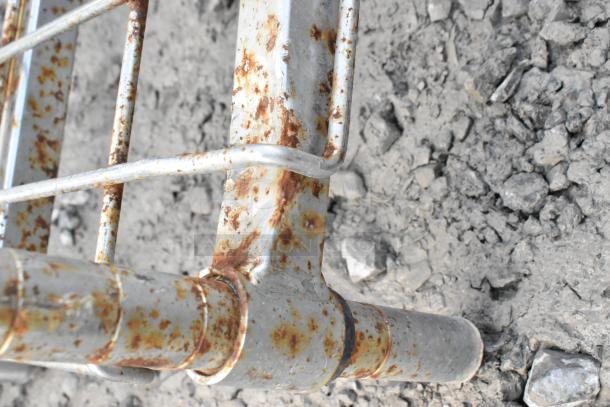 Metro chrome finish 5-tier wire shelving unit with visible rust, requiring dismantling by buyer. Consider freight charges.