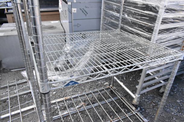 Metro Chrome Finish 5 Tier Wire Shelving Unit, sturdy, used condition, dismantling required, features adjustable shelves.