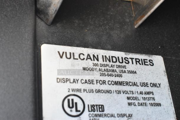 Vulcan 1013776 metal bakery display rack, on casters, with metal baskets. Industrial-grade, display case label visible.