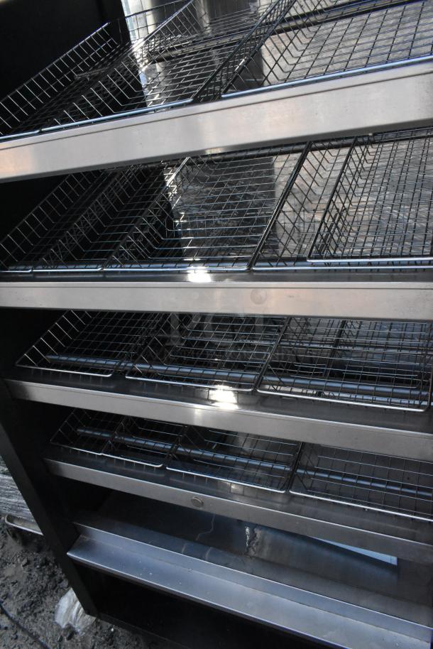 Vulcan 1013776 metal bakery display rack with metal baskets and commercial casters. Ideal for displaying pastries.