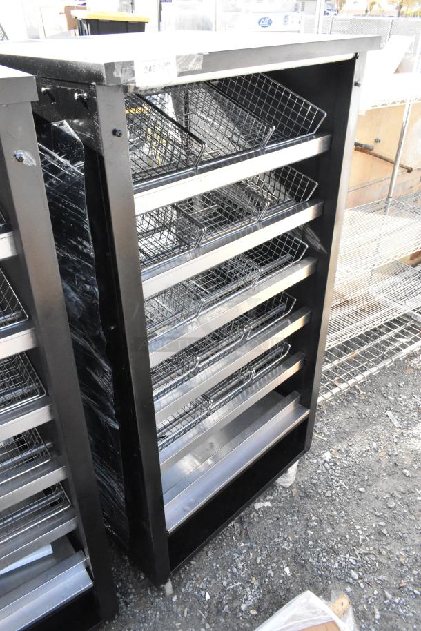 Vulcan 1013776 metal bakery display rack with wire baskets on commercial casters, in good used condition.