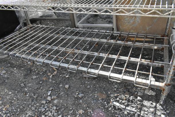 Metro Chrome 5-tier wire shelving unit, visible rust, worn condition, dismantling required, consider freight costs.