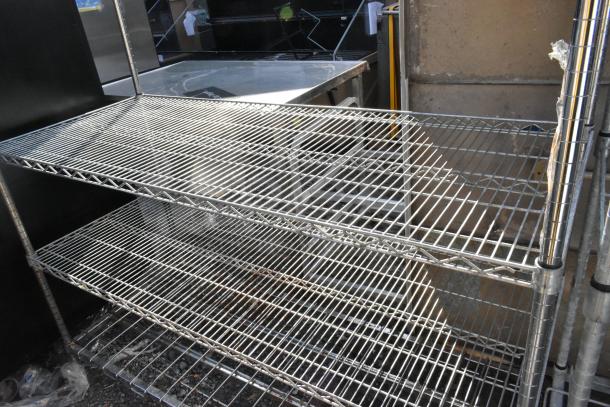 Metro Chrome Finish 5 Tier Wire Shelving Unit, sturdy, in used condition. Buyer must dismantle; consider freight charges.