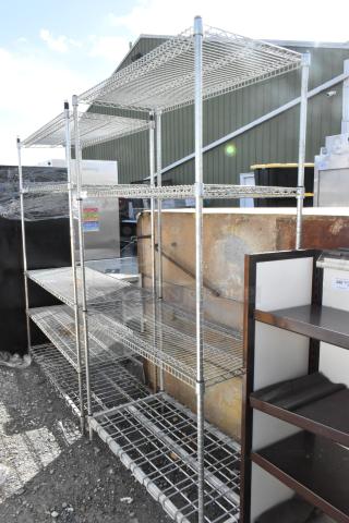 Metro 4-tier chrome wire shelving unit, dismantling required. Durable, ample storage, outdoor setting. Consider freight costs.