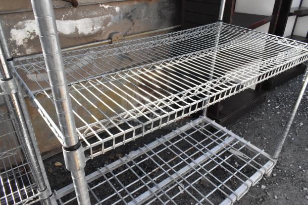 Metro Chrome Finish 4 Tier Wire Shelving Unit, sturdy chrome construction, dismantling required, freight charges apply.